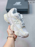 Angled side view showing the New Balance branding, layered upper and chunky outsole.