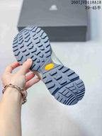 Underside view of the sneaker showing the lugged gray outsole and visible Vibram branding.