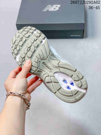 Underside view of the New Balance 509 sneaker showing the segmented tread pattern and central outsole detail.