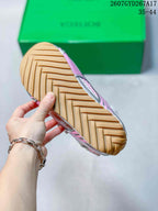 Close-up of the tan patterned outsole with embossed Bottega Veneta branding.