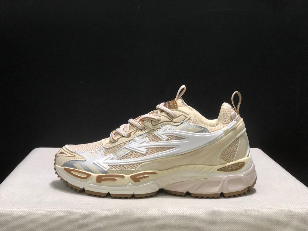 Outer side profile showing the large white arrow graphic, layered upper, and chunky cream outsole.