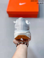 Rear view showing the padded heel, mesh-like upper and gum outsole.
