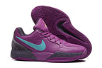 Purple Nike Ja 2 basketball shoes with turquoise accents, side and outsole views