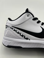 Side close-up showing the Swoosh, checkerboard heel trim, and midsole