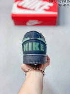 Rear view of the sneaker showing mint-green Nike branding on the black heel tab and a textured black outsole.