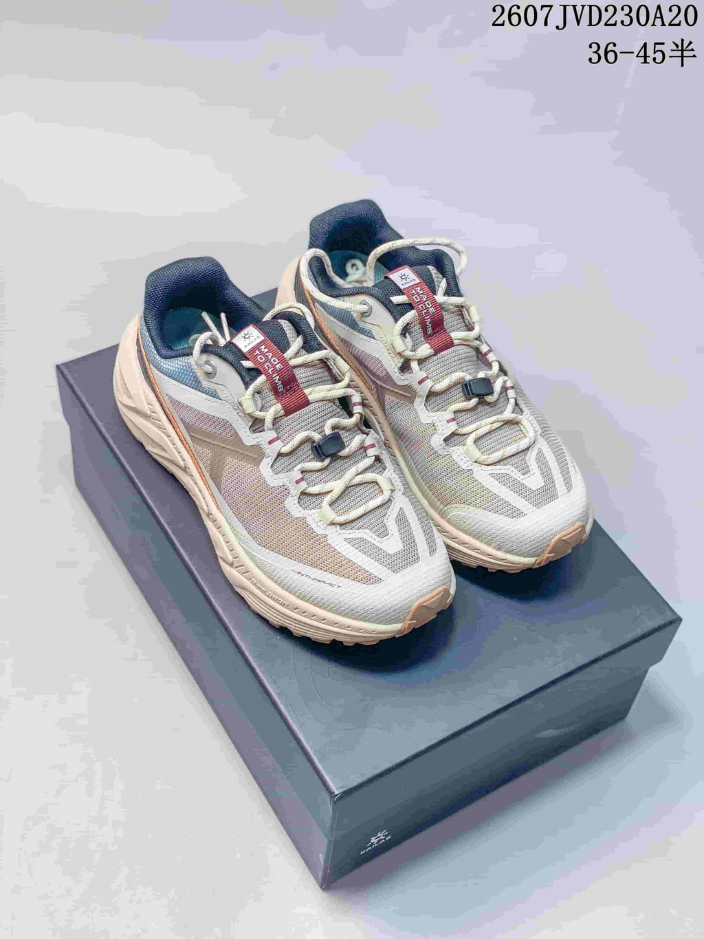 Pair of KAILAS low-top hiking shoes in off-white, gray, navy, and orange, displayed on a shoebox; image text shows style code 2607JVD230A20 and sizes 36–45 half sizes.