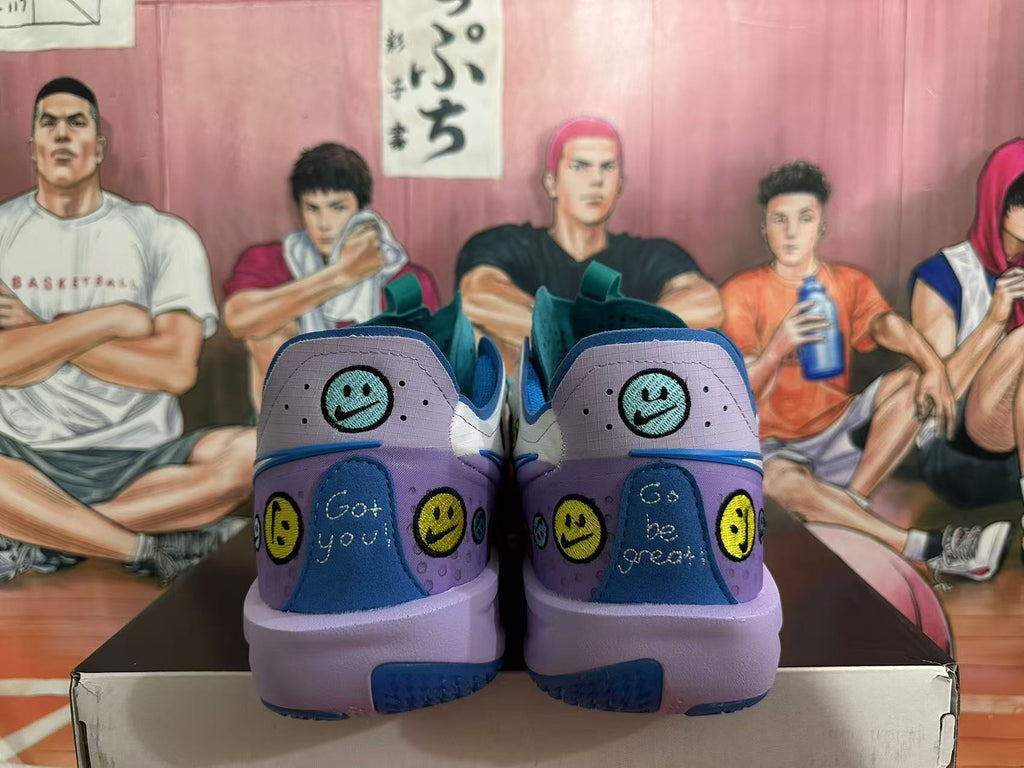 Rear view of purple and blue Nike basketball sneakers with smiley-face graphics, displayed on a shoebox.