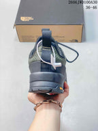 Rear view showing the heel pull tab, patterned upper, and outsole.