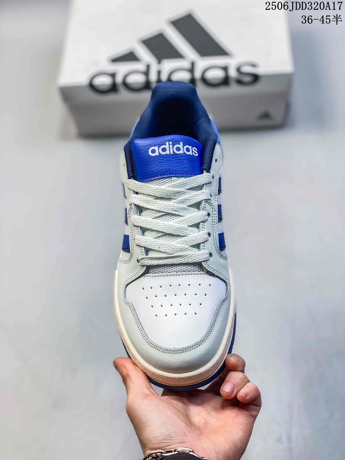 Front view of the adidas Entrap sneaker showing the white perforated toe box, blue tongue and white laces.