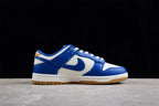 Side profile of the white and blue low-top sneaker with a blue Swoosh, white midsole, and gum outsole.