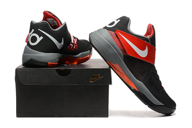 Black and red Nike KD 4 shoes displayed beside a black shoebox.