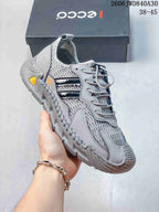 Side view of a light gray ECCO mesh sneaker with textured overlays and a treaded outsole