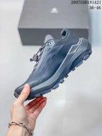 Side view showing the dark gray low-top profile, textured upper and rugged outsole.