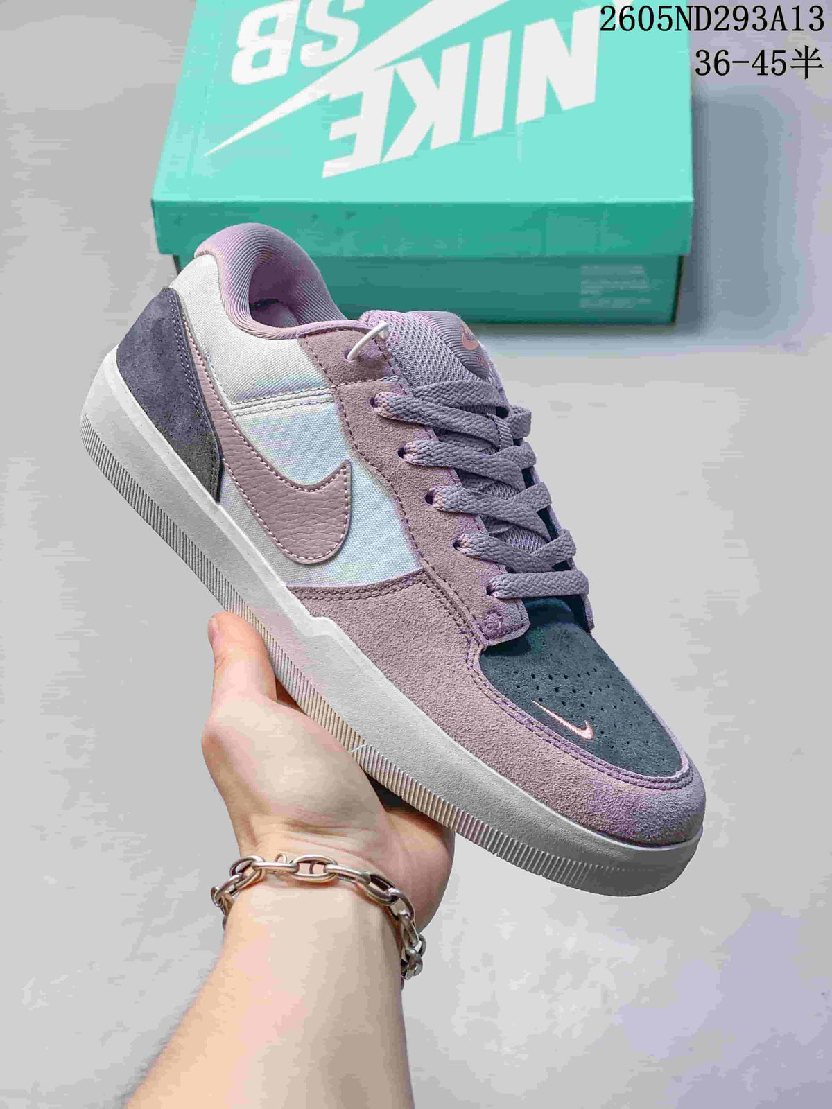 Purple and gray Nike SB Force 58 low-top shoe with perforated toe and textured sole.