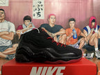 Side view of a black Nike basketball sneaker with layered wavy panels, red outsole and speckled midsole.
