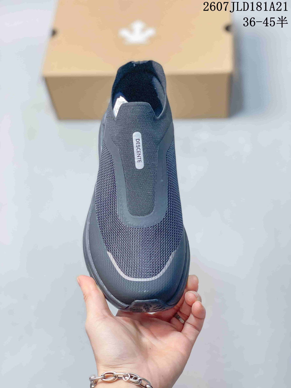 Top view of the black slip-on sneaker showing the slip-on opening, tonal panels and DESCENTE branding.