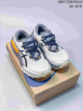 Pair of ASICS Trabuco Max 5 shoes in white, gray, navy, and orange displayed on an ASICS shoebox; source image shows the size range 36–45.