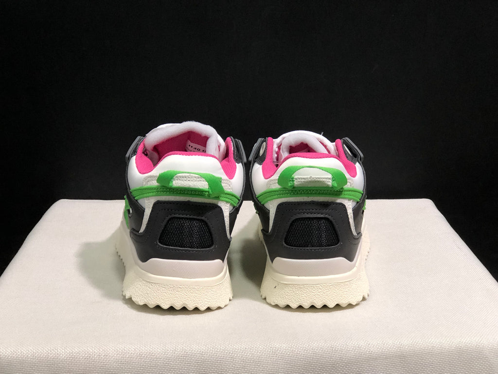 Rear view showing black heel panels, white collars, green rear pull tabs and pink interior lining.