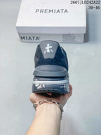 Rear view of the trainers showing the heel branding and layered dark gray sole.
