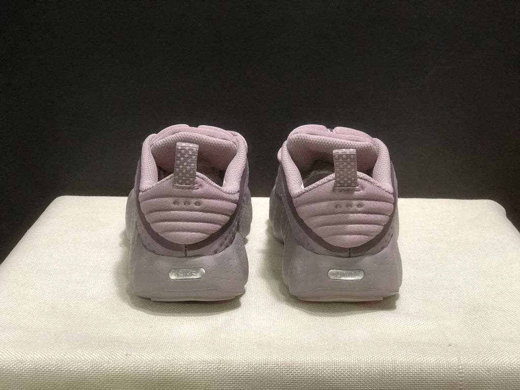 Rear view showing padded heels, pull tabs and embossed Nike details.