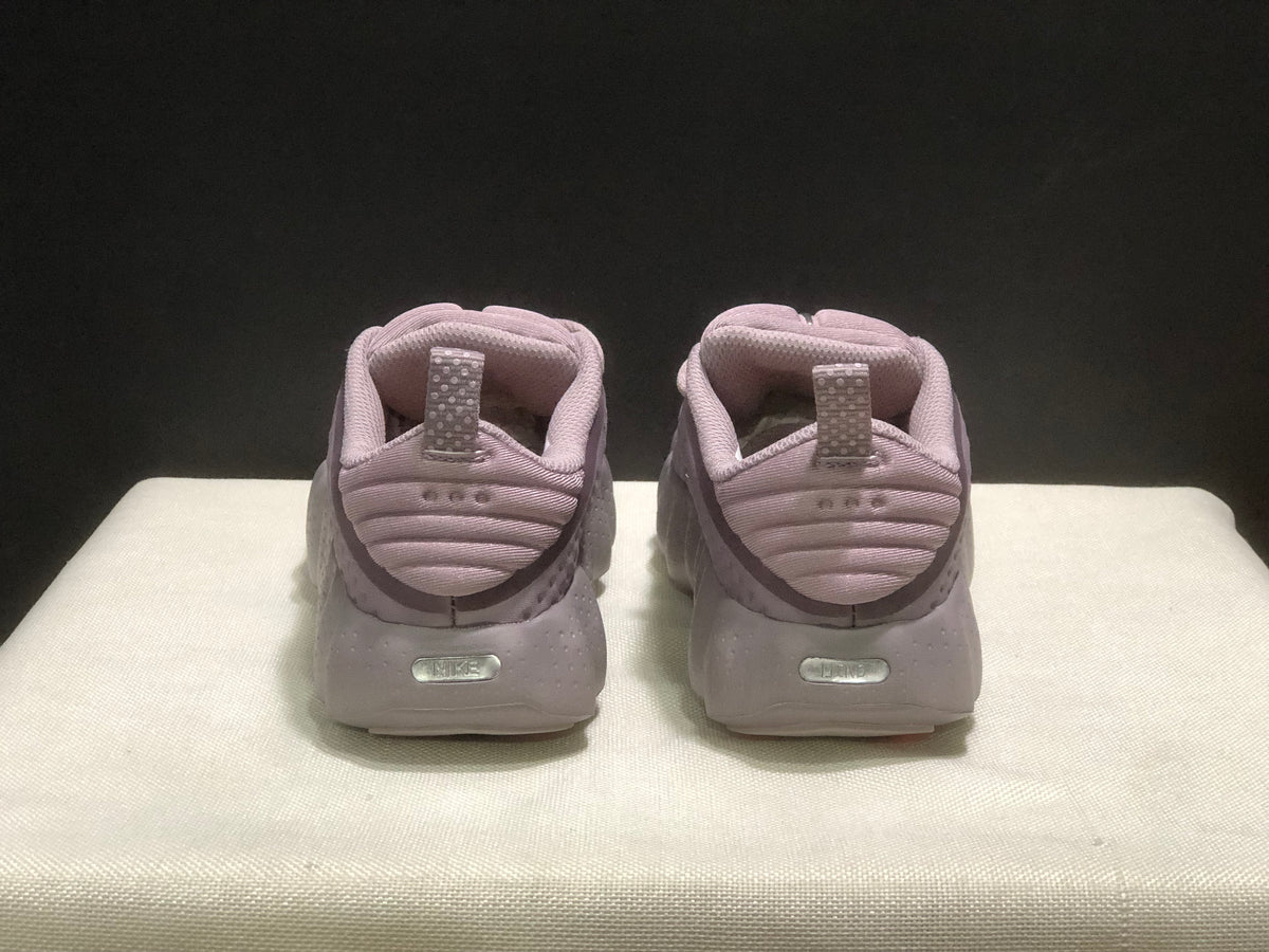 Rear view showing padded heels, pull tabs and embossed Nike details.