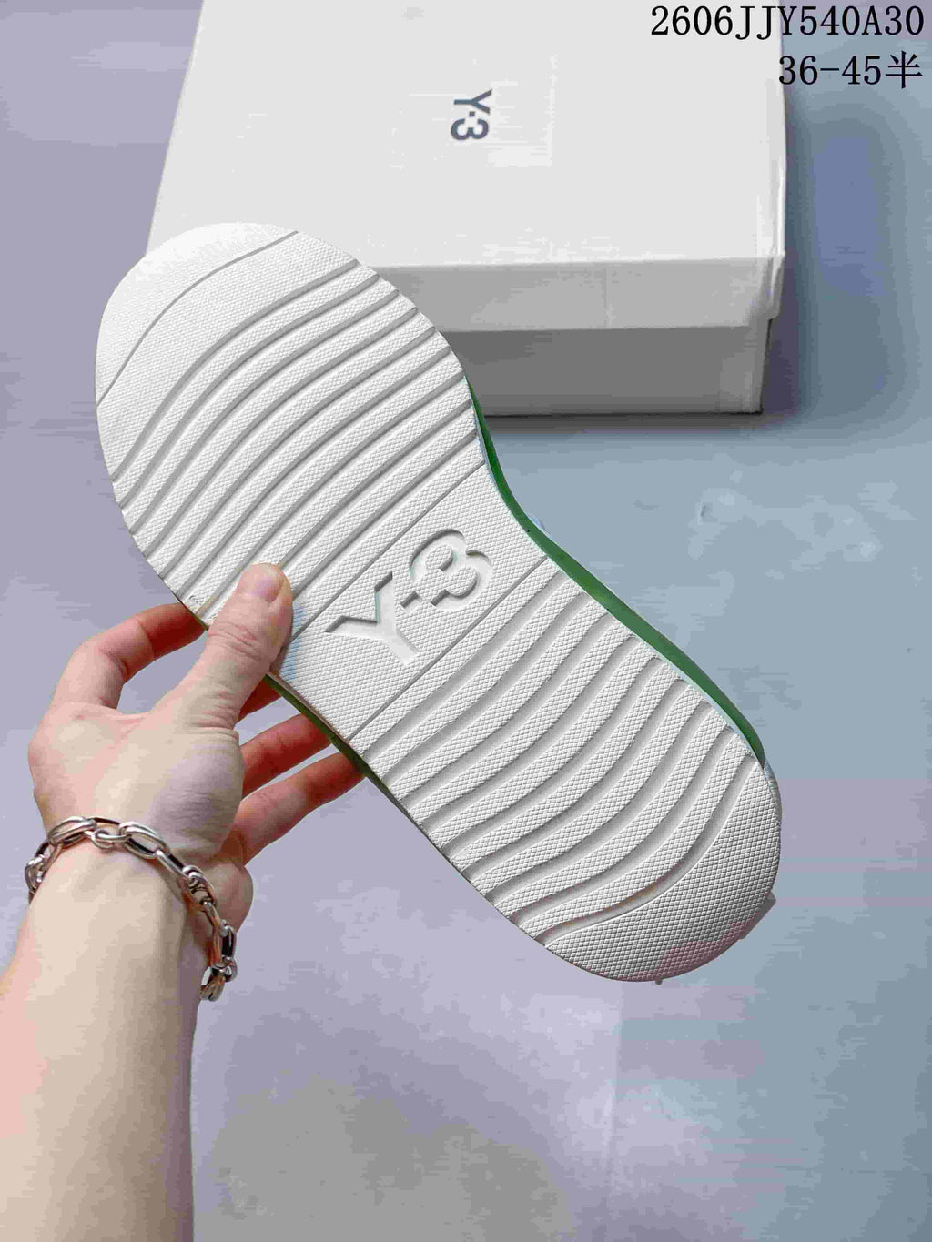 White outsole with Y-3 branding on a Rivalry sneaker