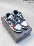 Pair of grey and white patterned Nike SB Dunk Low sneakers on a printed box