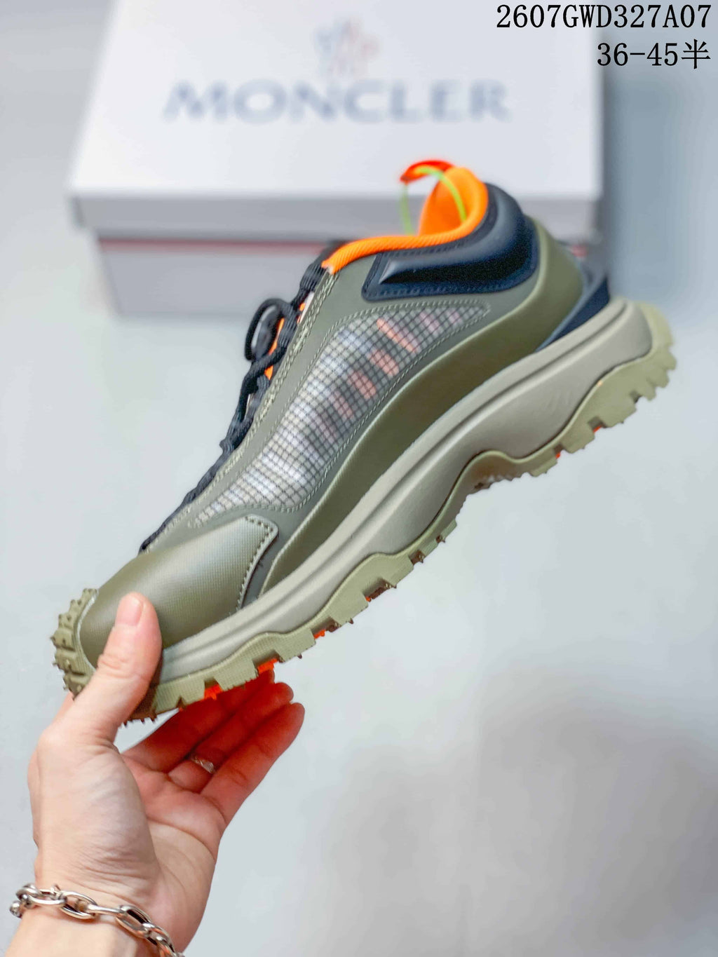 Side profile highlighting the low-top silhouette, lace-up closure, layered textile panels and thick outsole.