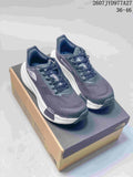 Pair of dark gray and navy The North Face Summit Vectiv Pro trail running shoes displayed on a shoebox.