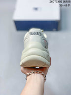Rear view of the sneaker showing the padded heel and visible YANKEES text on the collar.