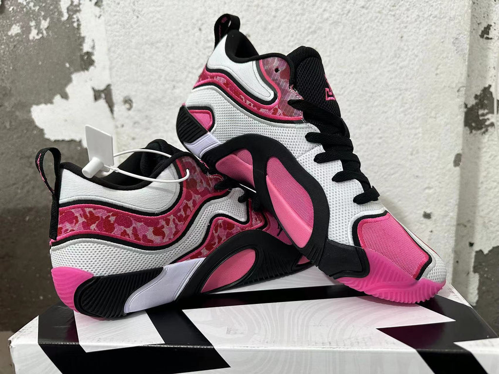Pair of black, white, and pink Jordan sneakers shown from multiple angles