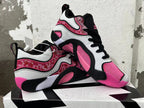 Pair of black, white, and pink Jordan sneakers shown from multiple angles