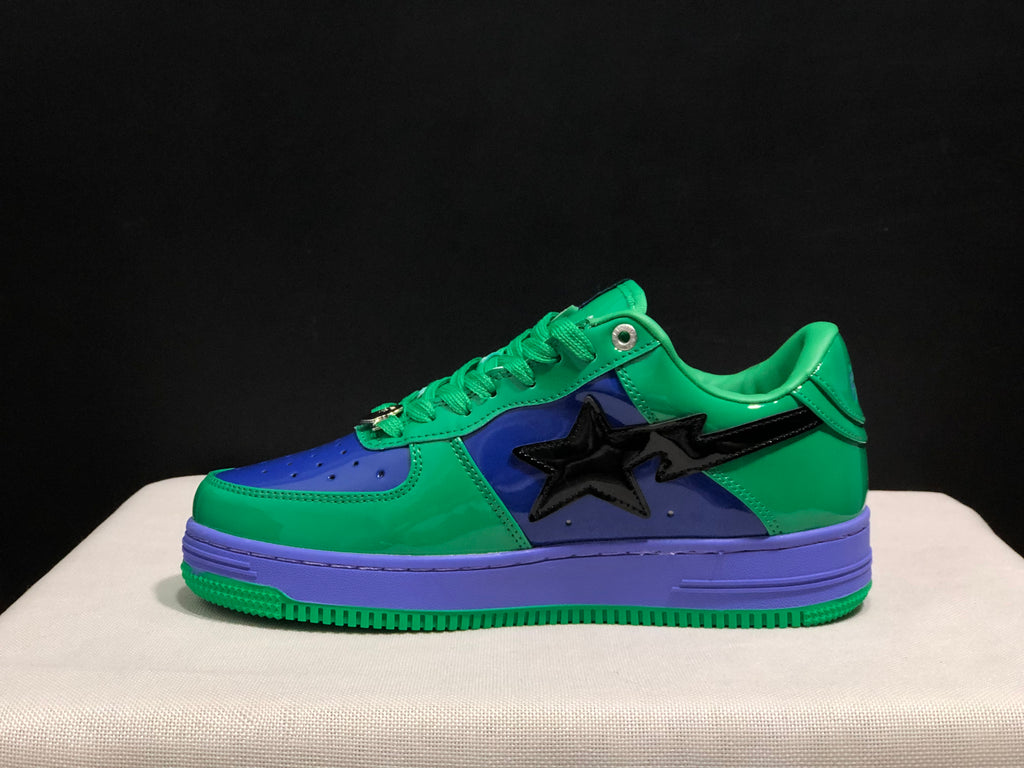 Side profile highlighting the black star-shaped detail, green upper and purple sole.