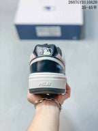 Rear view of the sneaker showing the dark heel panel, MLB heel branding, and layered sole.