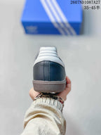 Rear view of the sneaker showing the black heel, white padded collar and textured gum-colored sole.