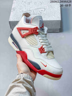 Angled side view of the white sneaker with red and grey accents and cream-toned outsole details.