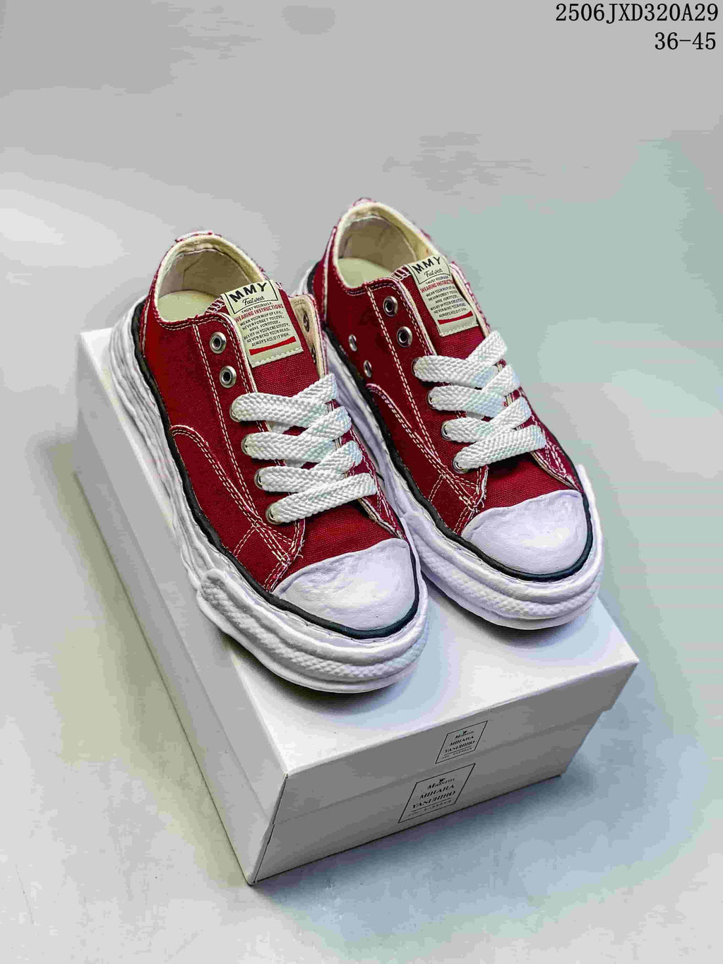 Pair of red MMY Blakey sneakers with white laces and sculpted white soles displayed on a shoebox; image text shows style code 2506JXD320A29 and size range 36–45.