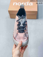 Top view of the shoe showing its laces and patterned pink upper
