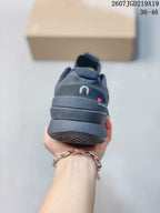 Rear view of the black On tennis shoe showing the padded heel and outsole edge.