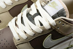 Close-up of the white laces, padded tongue, brown quarter panel, and contrasting Swoosh overlay.