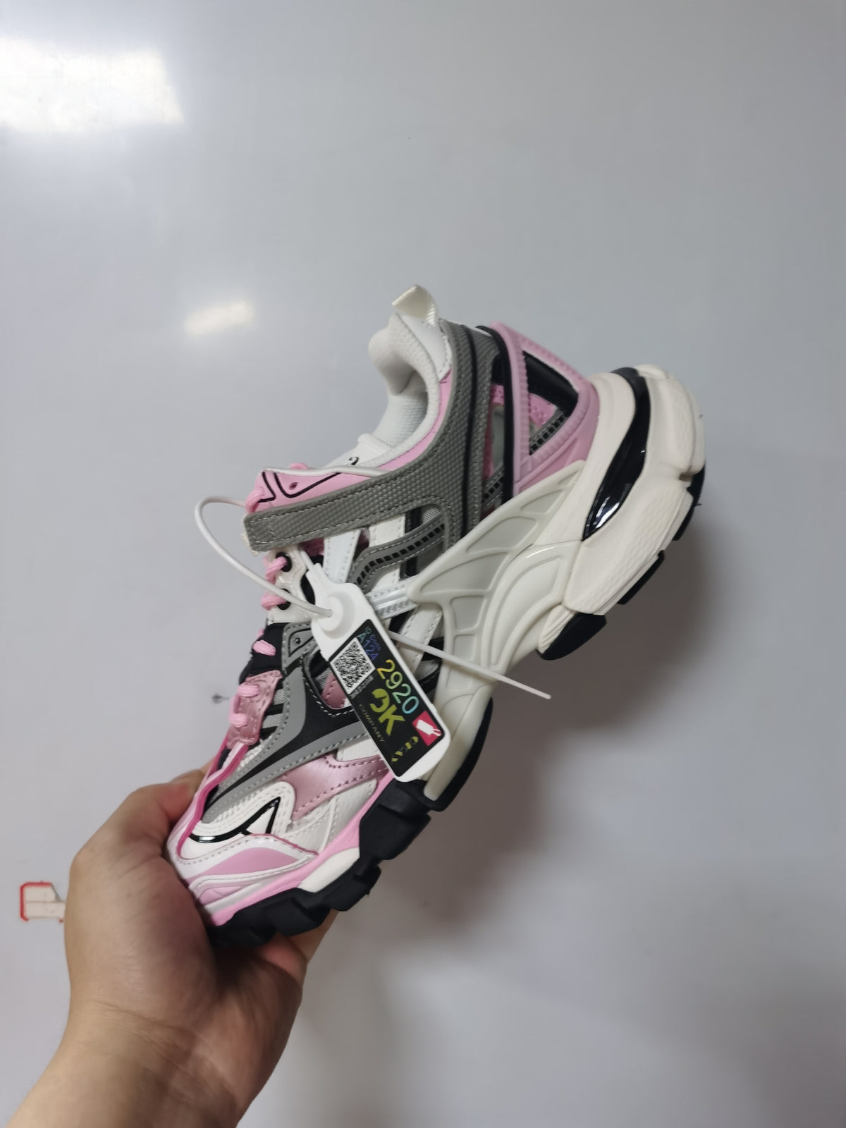 Angled view of the Balenciaga Track.2 sneaker showing the contrasting overlays, laces, side branding and chunky outsole.