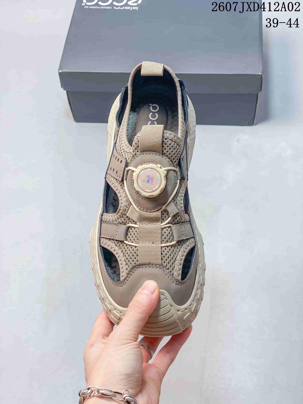 Top view of the sandal showing the dial-style fastening and closed toe.