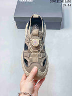 Top view of the sandal showing the dial-style fastening and closed toe.