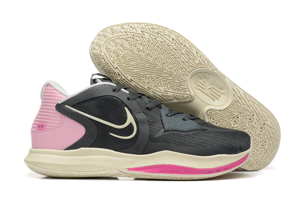 Black Nike Kyrie-style basketball shoe with pink and cream accents, shown beside its patterned outsole.