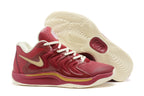 Red and gold Nike KD 17 basketball shoes with an off-white outsole.