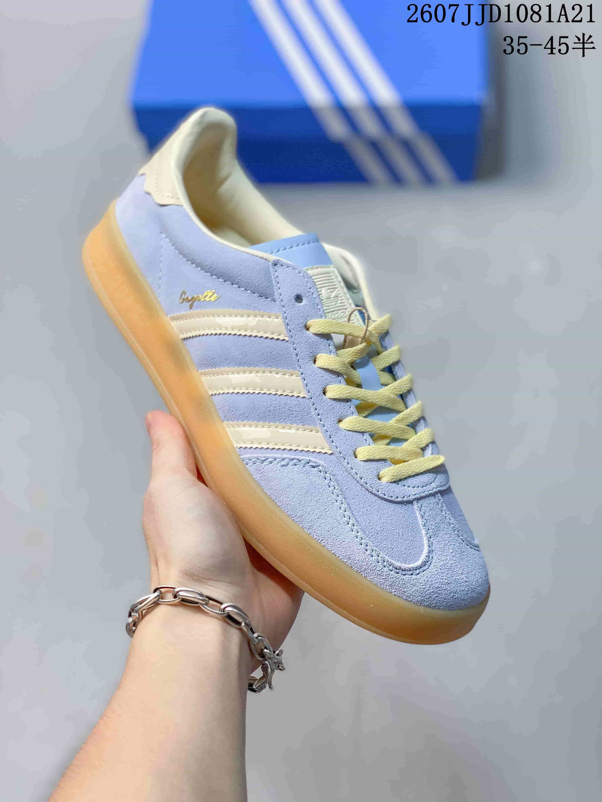 Angled side view highlighting the low-top silhouette, cream stripes, yellow laces, and gum outsole.