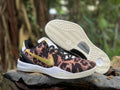 Nike Kobe 8 shoes with leopard-inspired uppers, gold Swooshes, and a view of the outsole