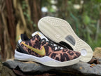 Nike Kobe 8 shoes with leopard-inspired uppers, gold Swooshes, and a view of the outsole