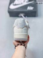 Rear view showing the padded heel, Nike Air tongue label and Louis Vuitton text detail.