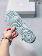 Close view of the textured rubber outsole with circular traction patterns and Nike branding.
